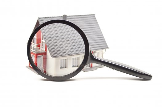 magnifying glass over a house, credit monitoring, myfico