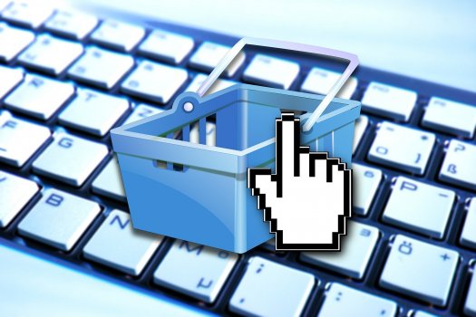 hand cursor and shopping cart on keyboard, ecommerce, fortune3